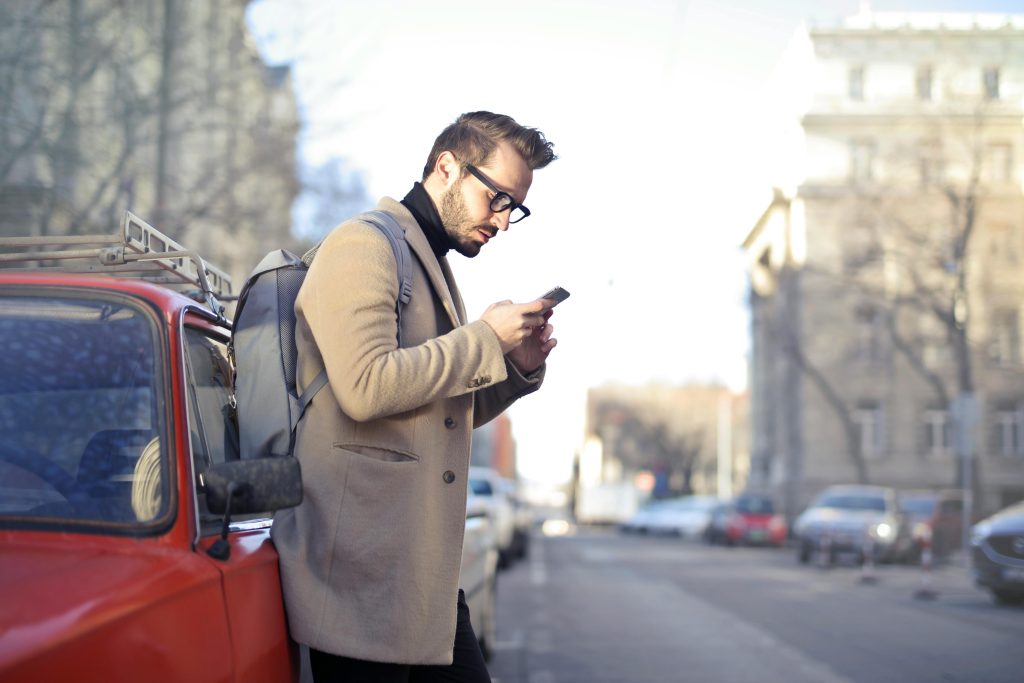 Image of man looking at his phone